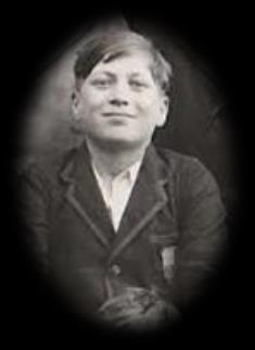 George as a schoolboy, in a jacket and tie.