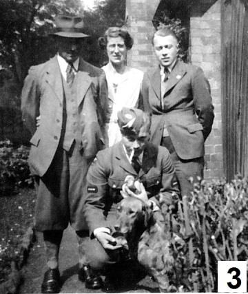 George in uniform with members of his family outdoors.